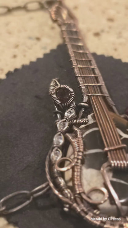 Stonebreaker - Thunderstorm inspired Guitar Necklace